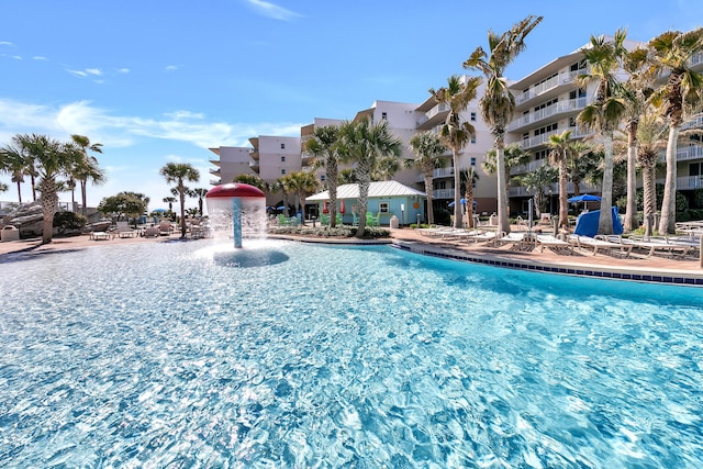view of pool with pool water feature
