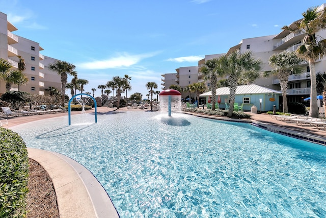 view of pool with pool water feature