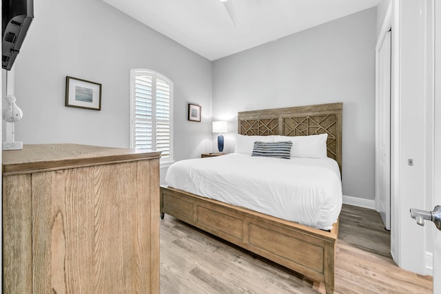 bedroom featuring wood-type flooring and ceiling fan