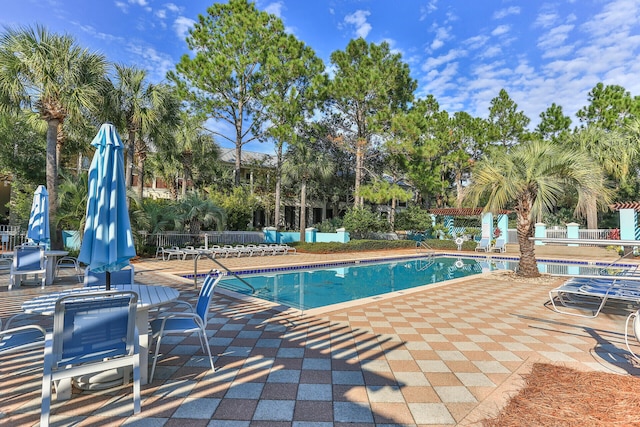 view of swimming pool featuring a patio area