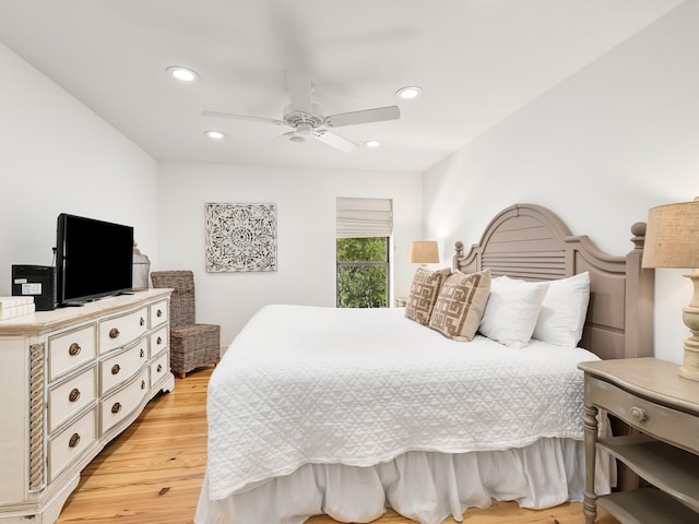 bedroom featuring ceiling fan and light hardwood / wood-style flooring