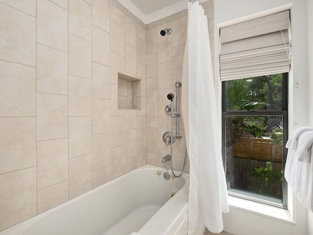 bathroom featuring shower / bathtub combination with curtain