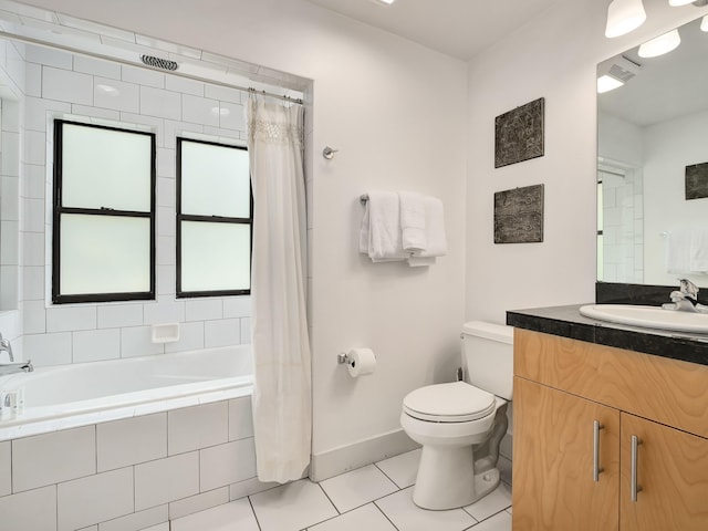 full bathroom featuring tile patterned flooring, vanity, shower / tub combo with curtain, and toilet