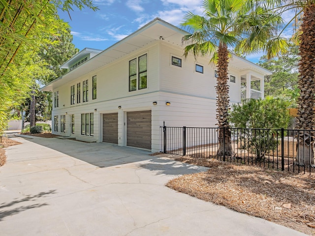 view of side of property featuring a garage