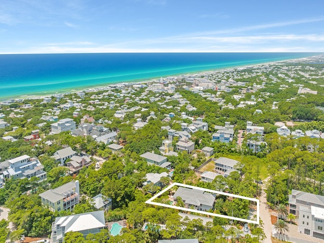 bird's eye view with a water view and a view of the beach