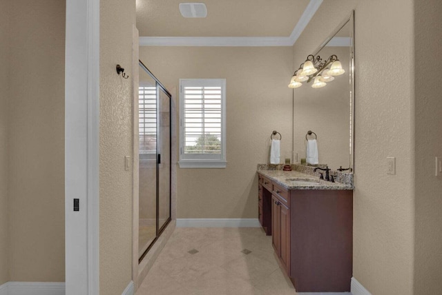 bathroom with vanity, an enclosed shower, and crown molding