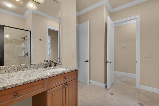 bathroom featuring vanity, a tile shower, ornamental molding, and tile patterned flooring