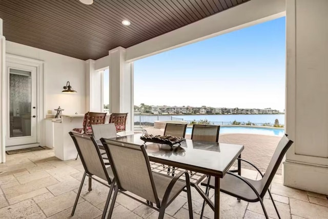 view of patio with a water view