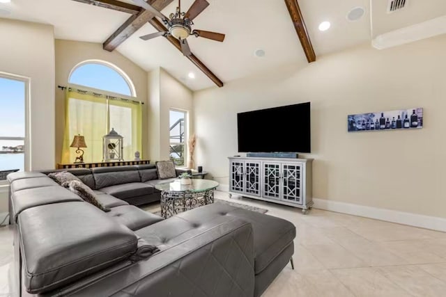 living room with ceiling fan, high vaulted ceiling, beam ceiling, and light tile patterned flooring