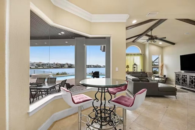 interior space with crown molding, lofted ceiling with beams, a water view, and ceiling fan