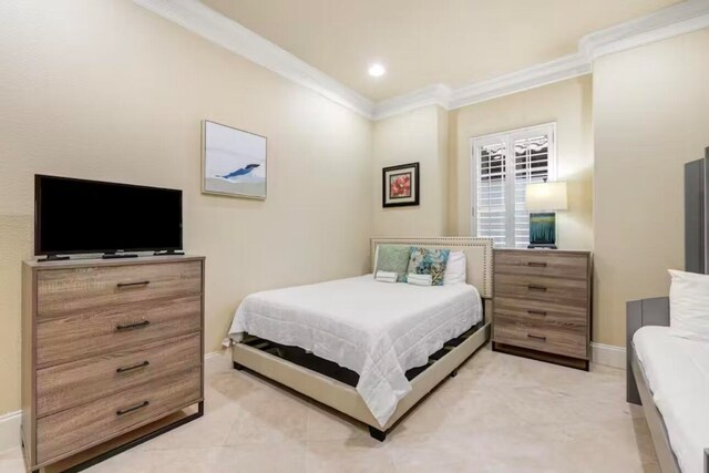 bedroom featuring crown molding