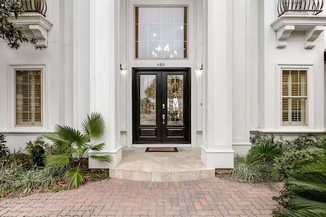 property entrance featuring french doors