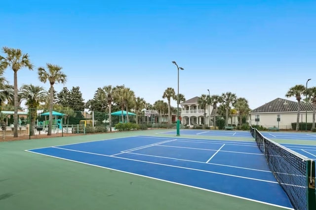 view of sport court with basketball hoop