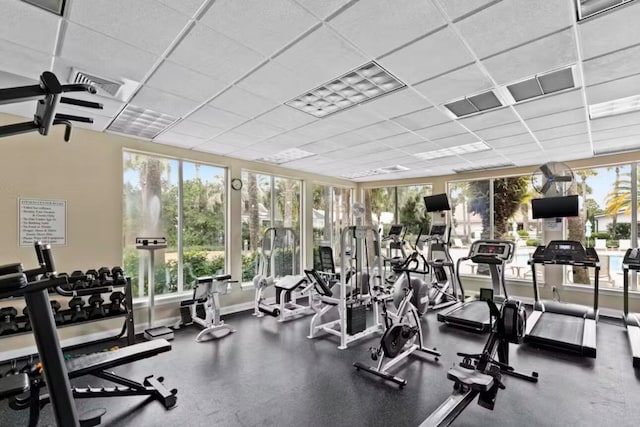 exercise room featuring a paneled ceiling