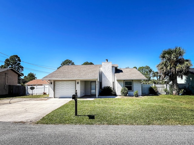 ranch-style house featuring a garage and a front lawn