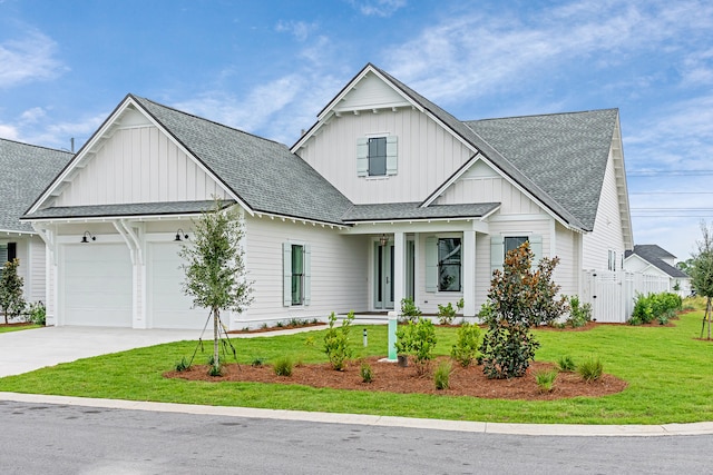 modern farmhouse style home featuring a garage and a front yard