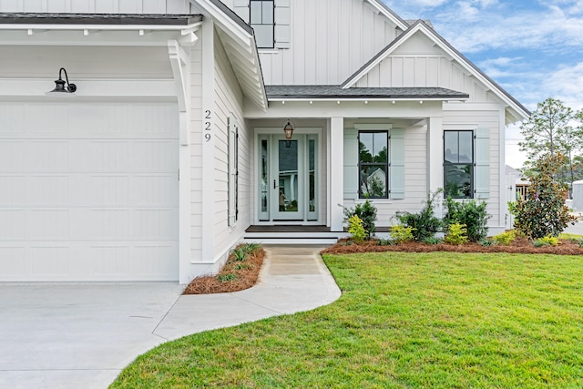 doorway to property featuring a lawn