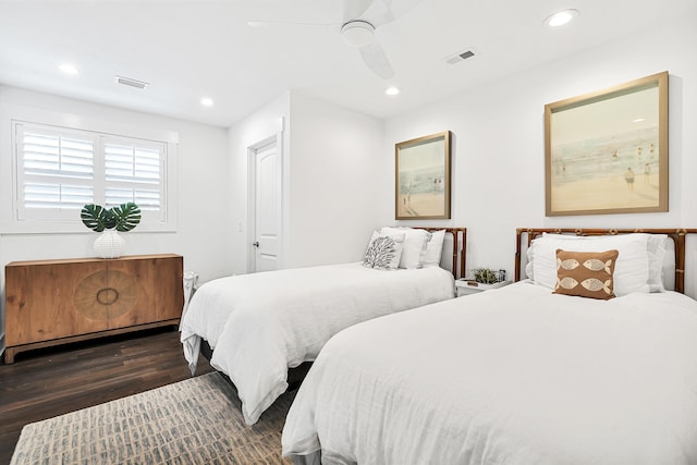 bedroom featuring ceiling fan and dark hardwood / wood-style floors