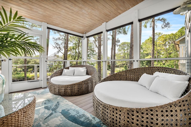 sunroom / solarium with lofted ceiling and wooden ceiling