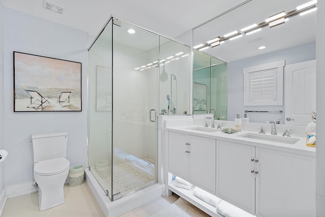 bathroom featuring an enclosed shower, tile patterned floors, vanity, and toilet