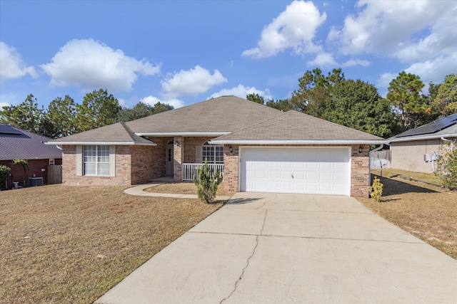 ranch-style house with a front lawn and a garage