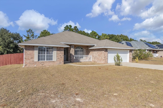 single story home featuring a front yard and a garage