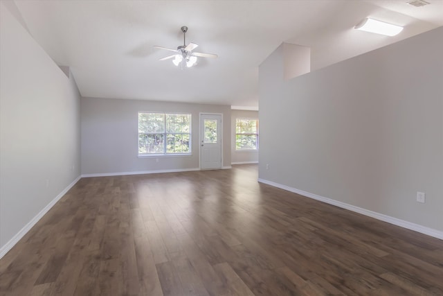 spare room featuring dark wood-type flooring and ceiling fan