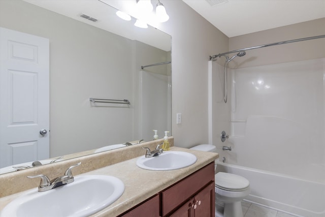 full bathroom with vanity, toilet, washtub / shower combination, and tile patterned flooring