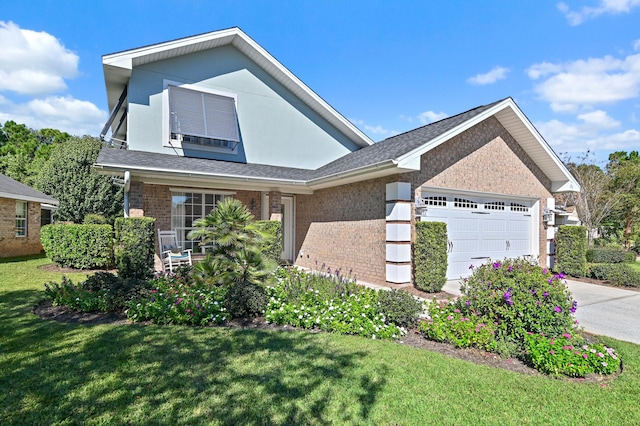 view of front of property with a garage and a front lawn