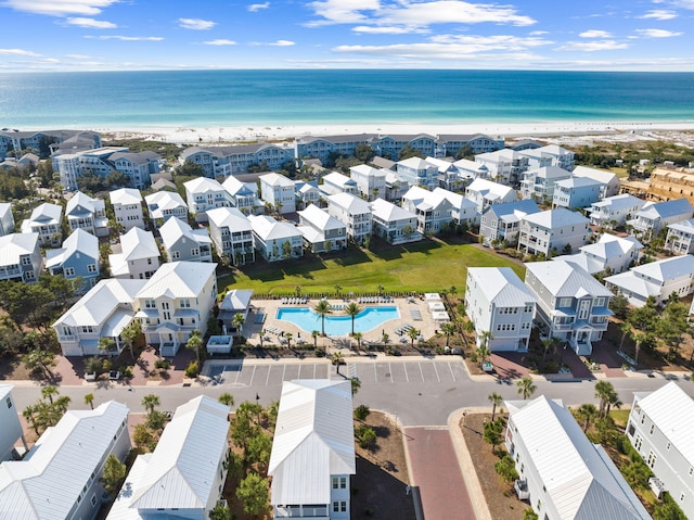 birds eye view of property with a view of the beach and a water view