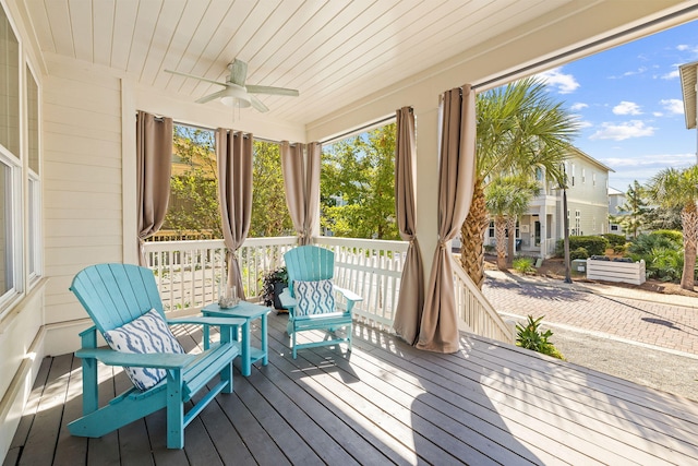 sunroom / solarium with ceiling fan