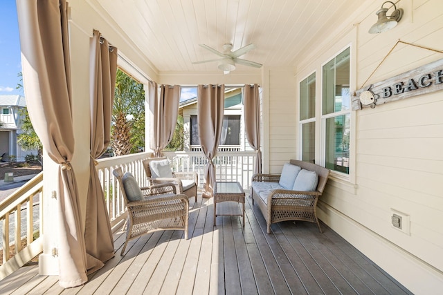 sunroom featuring wood ceiling, plenty of natural light, and ceiling fan