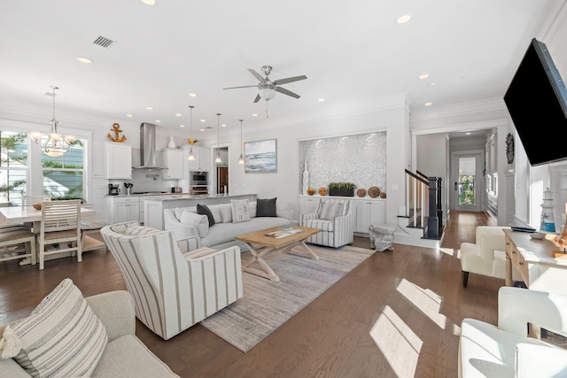 living room featuring ornamental molding, a wealth of natural light, and dark hardwood / wood-style floors