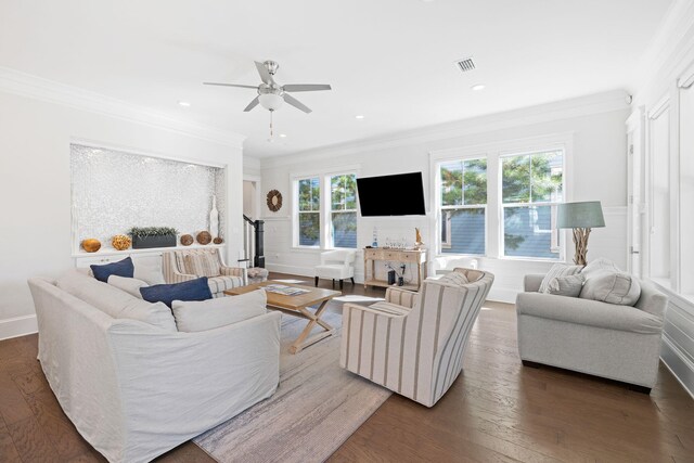 living room with ceiling fan, ornamental molding, and dark hardwood / wood-style flooring