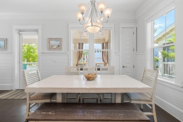 dining room featuring ornamental molding, dark hardwood / wood-style floors, and a wealth of natural light