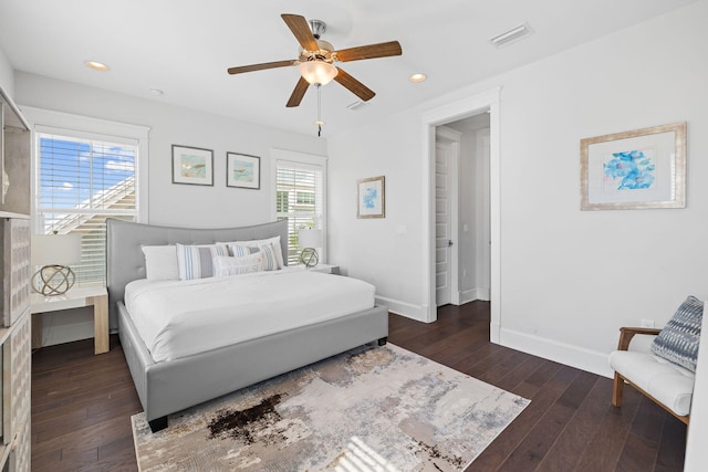 bedroom with dark wood-type flooring and ceiling fan