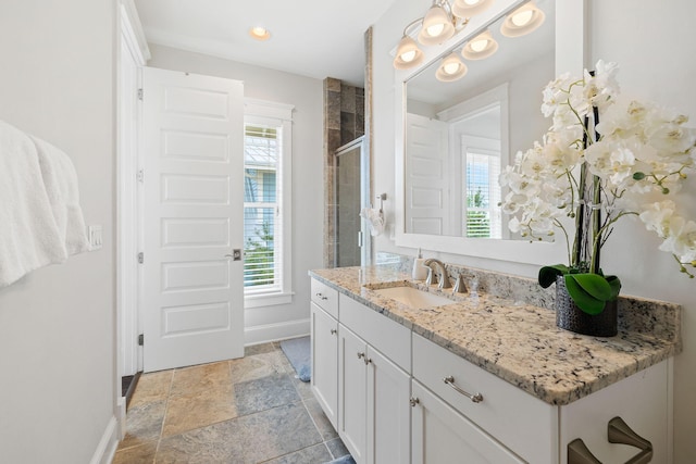 bathroom with vanity and walk in shower