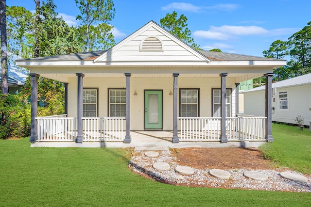 view of front of house with a front lawn and a porch