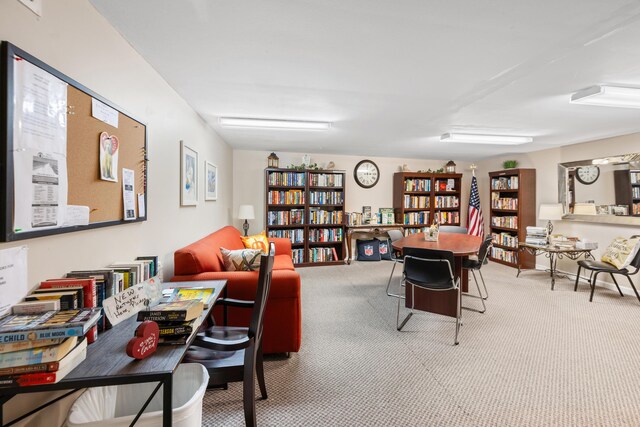 778 Scenic Gulf Dr Unit 423, Miramar Beach, FL 32550 - living area featuring carpet and wall of books