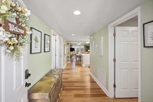 778 Scenic Gulf Dr Unit 423, Miramar Beach, FL 32550 - corridor featuring light wood-type flooring and recessed lighting