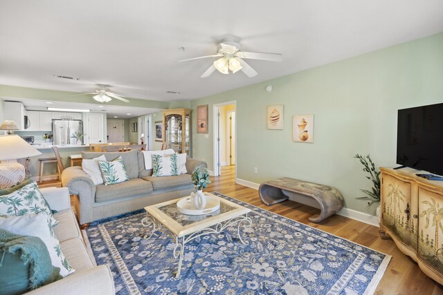 778 Scenic Gulf Dr Unit 423, Miramar Beach, FL 32550 - living area featuring ceiling fan, light wood-style flooring, and baseboards