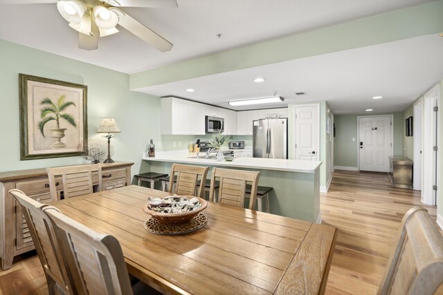 778 Scenic Gulf Dr Unit 423, Miramar Beach, FL 32550 - dining room featuring light wood-style flooring, ceiling fan, and recessed lighting