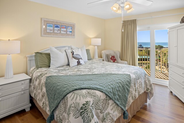 778 Scenic Gulf Dr Unit 423, Miramar Beach, FL 32550 - bedroom with access to outside, wood finished floors, a ceiling fan, and a water view