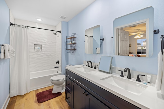 778 Scenic Gulf Dr Unit 423, Miramar Beach, FL 32550 - full bath with wood finished floors, ceiling fan, double vanity, shower / bath combo, and toilet