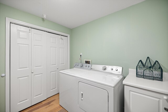 778 Scenic Gulf Dr Unit 423, Miramar Beach, FL 32550 - clothes washing area with washer and clothes dryer and light wood-style flooring