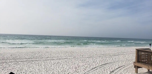 property view of water featuring a beach view