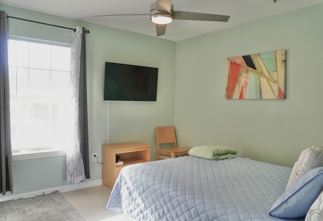 bedroom featuring ceiling fan and light tile patterned floors