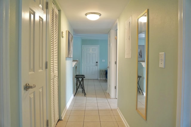 corridor with light tile patterned floors