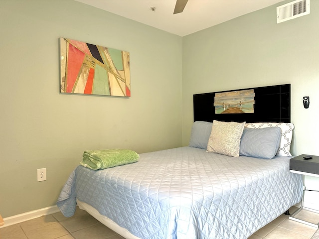 bedroom with tile patterned floors and ceiling fan