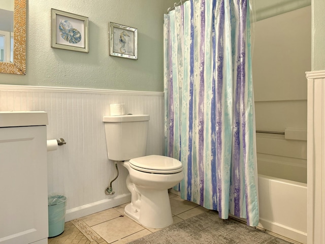 full bathroom featuring tile patterned floors, vanity, shower / bath combo, and toilet